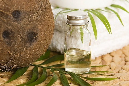 Coconut_Oil_For_Oil_Pulling Picture of coconut oil with coconut and towel